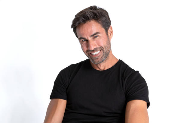 istock Handsome middle aged hispanic man wearing black t-shirt and smiling looking at camera. 1457700787
