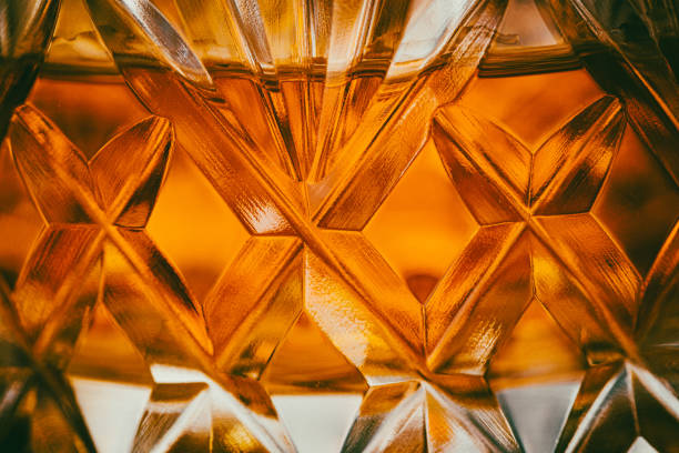 close up view of whisky in a crystal glass tumbler - shot glass glass alcohol color image imagens e fotografias de stock