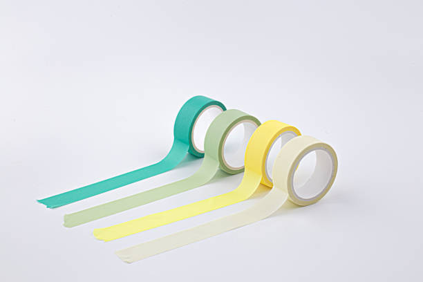 colorful masking tape rolls background on white stock photo