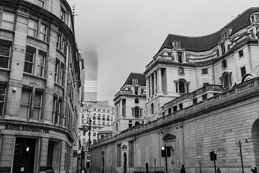 London Financial district on a foggy day in November 2022. This is a rear view of the Bank of England on the right. London, England, UK.