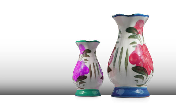 istock colorful ceramic vases of two sizes on a white floor, grey wall background, object, decor, vintage, copy space 1457713357
