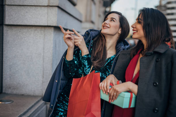 istock Women looking in store window 1457714218