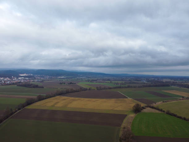 istock Green fields in Bavaria in the valley with aerial view 1457714244