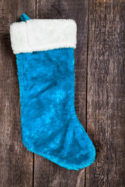istock Christmas decoration stocking on rustic wooden background 1457716126