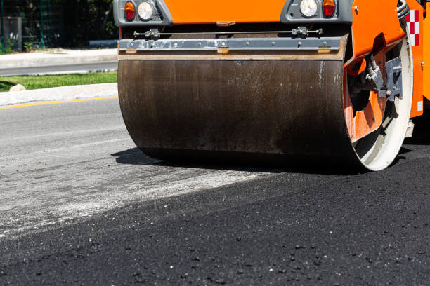 istock Road construction works with steamroller machine and asphalt finisher 1457718808