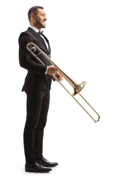 istock Full length profile shot of trombone player standing and smiling 1457719782