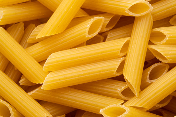 istock Close up uncooked Penne rigate macaroni 1457723450