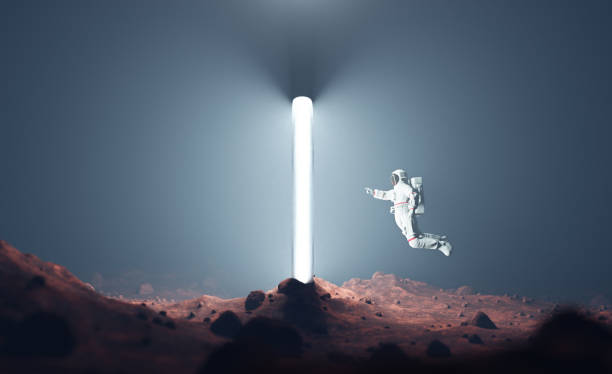 istock Astronaut on alien planet entering spacetime portal light 1457723456