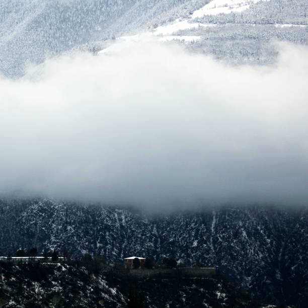 istock Winter landscape with mountains and clouds 1457723960