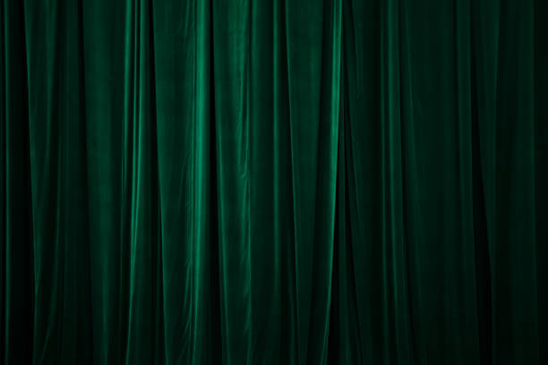 green curtain in theatre. Textured green curtain in theatre. Textured background velvet curtain stock pictures, royalty-free photos & images