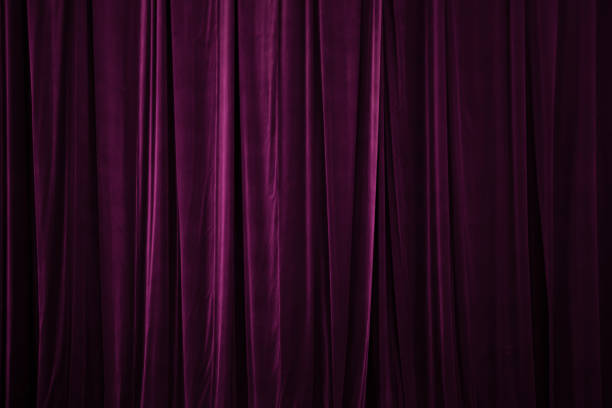 istock burgundycurtain in theatre. Textured 1457726112