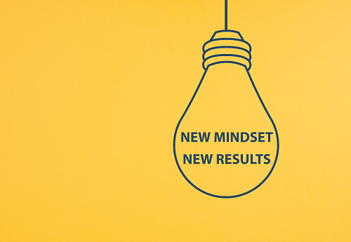 New mindset new result is standing inside the light bulb, business and education concept