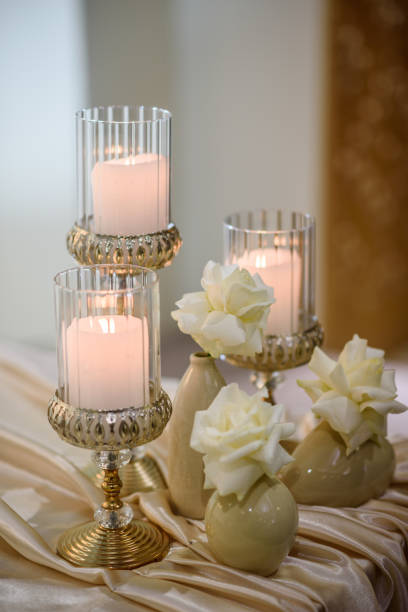 istock Wedding setup detail. Table setting, serving closeup. Banquet decoration in hall restaurant. Luxury reception. Festive table covered tablecloth, decorated composition flowers and candles in party area 1457727643