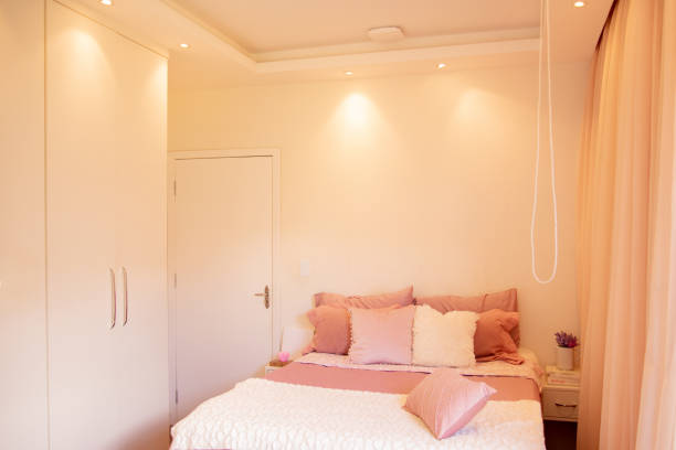 bed with white pillows and bed sheets that someone has slept in recently