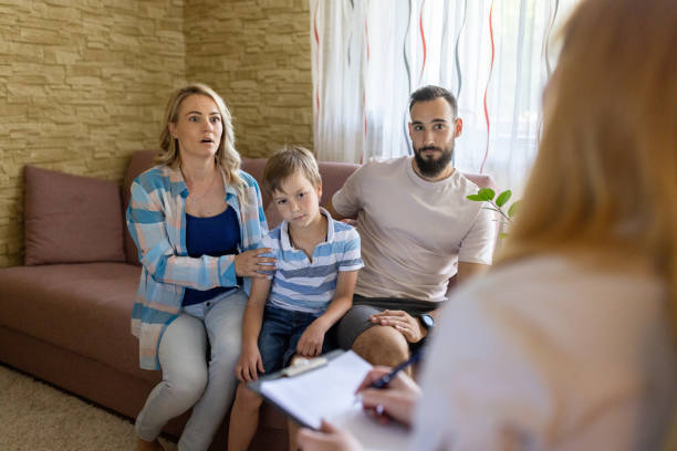 istock Couple and their son talking whit psychiatrist 1457729744