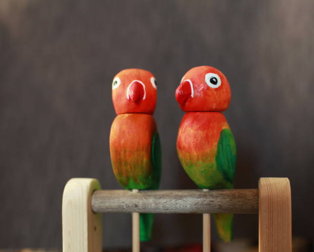 istock pair of funny lovebird parrots 1457731860