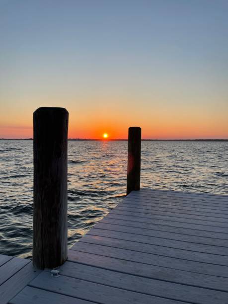 istock Deep orange sunset off dock on the bay 1457732316