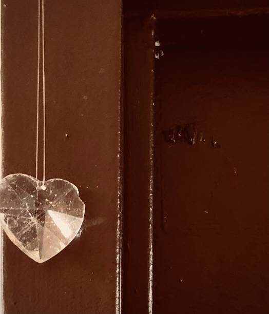 istock Chipped Heart Crystal On Dilapidated Door 1457733241