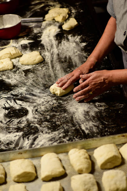 istock Bread being put to bake. Homemade bread preparation. 1457735313