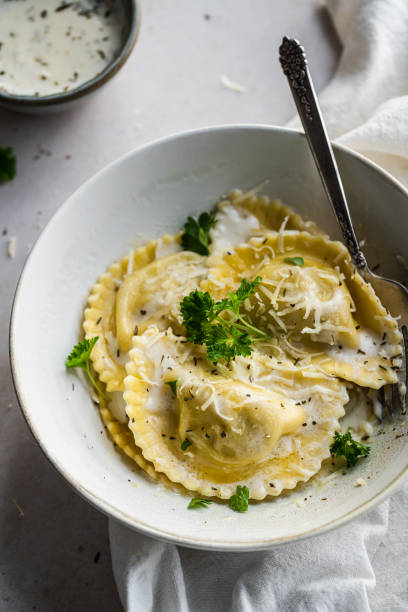 istock Mezzelune with creamy sauce and parmesan 1457737040