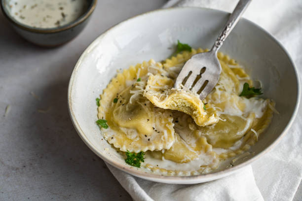 istock Mezzelune with creamy sauce and parmesan 1457737064