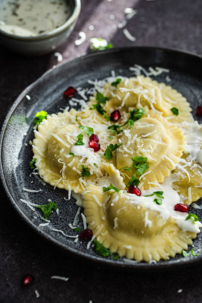 istock Mezzelune with creamy sauce and parmesan 1457737599
