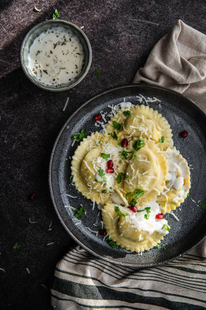 istock Mezzelune with creamy sauce and parmesan 1457737657
