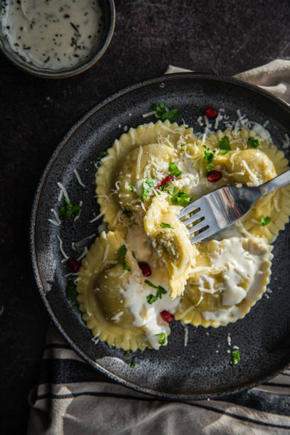istock Mezzelune with creamy sauce and parmesan 1457737680