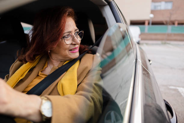 istock senior woman driving car with eyeglasses 1457737806