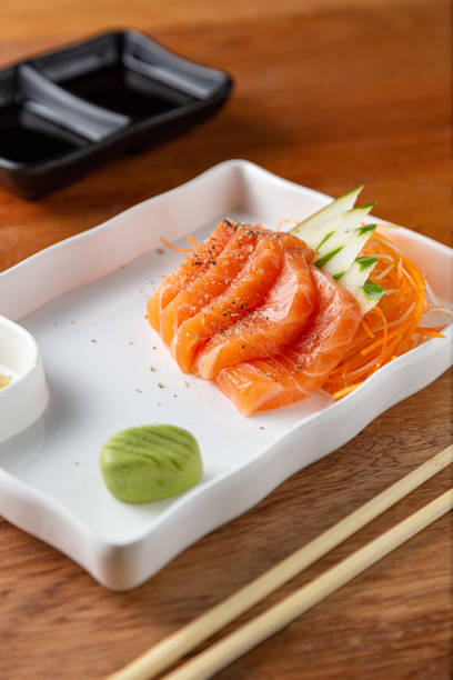 istock Portion of sashimi on the wooden table. 1457739166