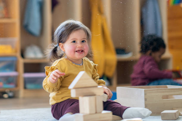 istock Little Girl Playing with Blocks 1457739694