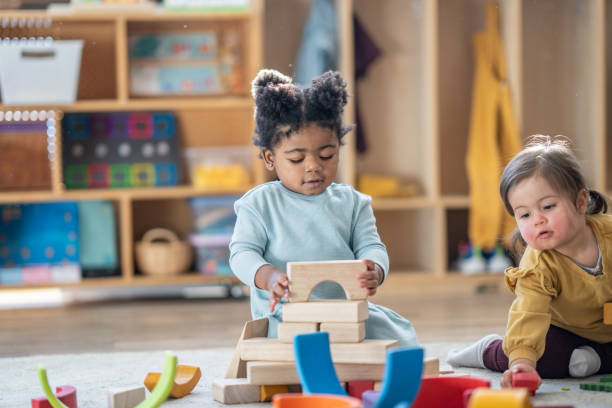 istock Little Girls Playing with Blocks 1457739720