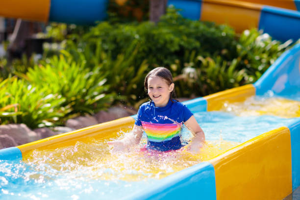 istock Kids on water slide in aqua park. Summer vacation 1457739763