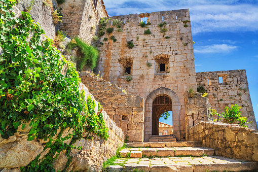 Summer landscape - view of the stairs in the Klis Fortress near Split on the Adriatic coast of Croatia