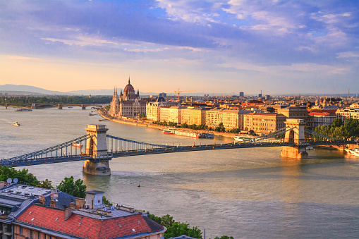City summer landscape at sunset - top view of the historical center of Budapest with the Szechenyi Chain Bridge over the Danube, Hungary