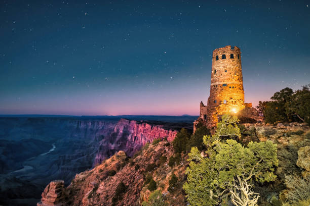 Grand Canyon National Park Starry Night Desert View Watchtower Arizona Desert View Watchtower and starry night in Grand Canyon National Park, Arizona, USA. south rim stock pictures, royalty-free photos & images