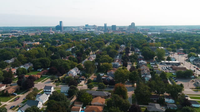 Grand Rapids Michigan City Skyline Aerial Flying Over Trees & Houses