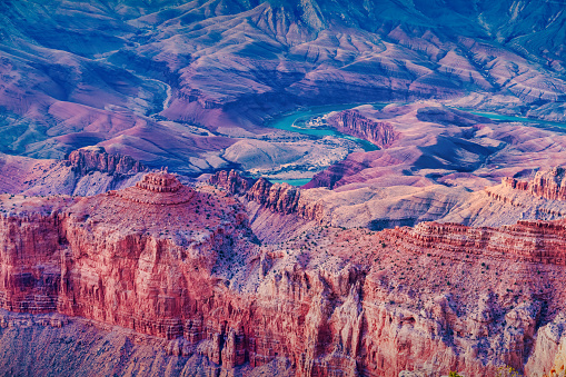 Close-up shot of eroded peaks and the Colorado River in Grand Canyon National Park, South Rim, Arizona, USA at twilight.