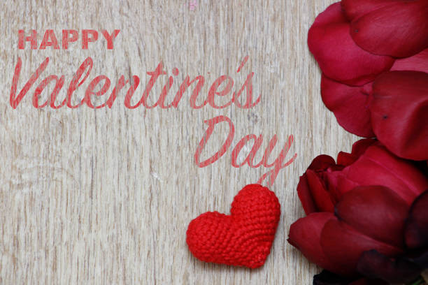 istock Happy Valentine's Day. Red little heart and rose on wooden texture. Top view. 1457745853
