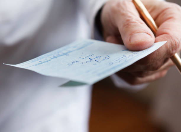 istock Doctor Holding Prescription 1457746815