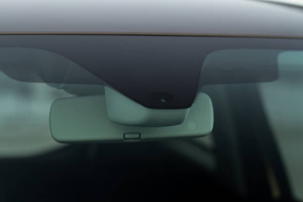 istock Rain and light sensor on the windshield of the car. Modern car safety feature. 1457750301