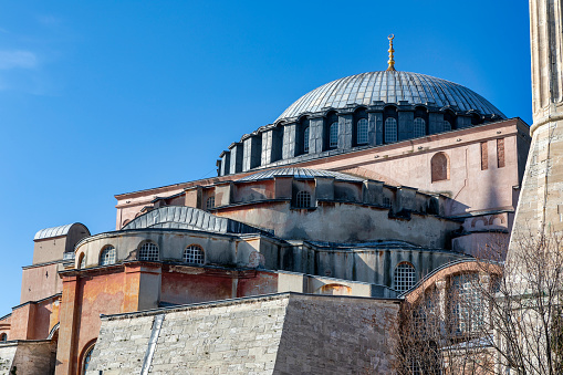 Architectural detail from Hagia Sophia or Ayasofya Mosque over sunny blue sky in Istanbul, Turkey