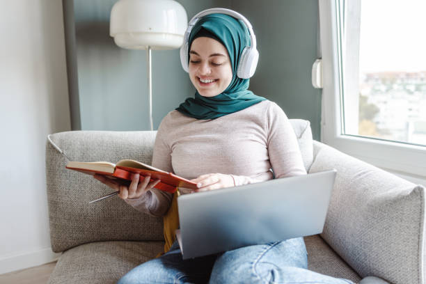 istock Young Muslim woman studying at home 1457751258