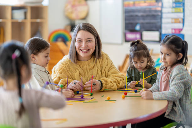 istock Kindergarten Students with Their Teacher 1457754078