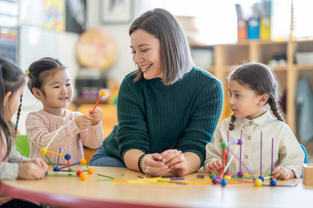 istock Kindergarten Students with Their Teacher 1457754083