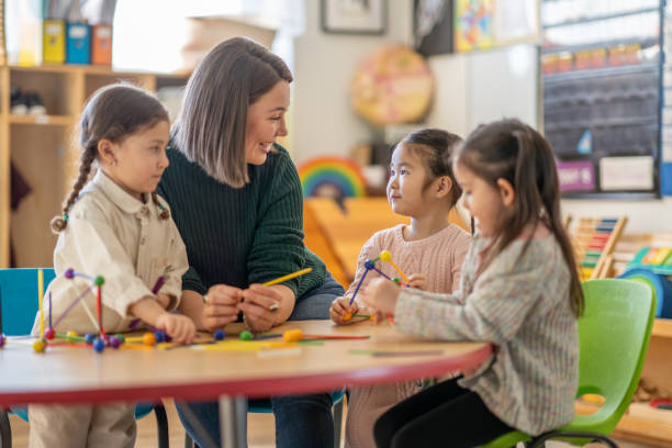 istock Kindergarten Students with Their Teacher 1457754107