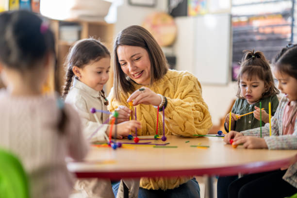 istock Kindergarten Students with Their Teacher 1457758254