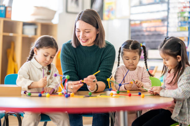 istock Kindergarten Students with Their Teacher 1457758278