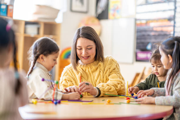 istock Kindergarten Students with Their Teacher 1457758286