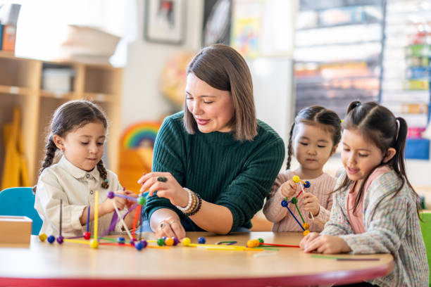 istock Kindergarten Students with Their Teacher 1457758295